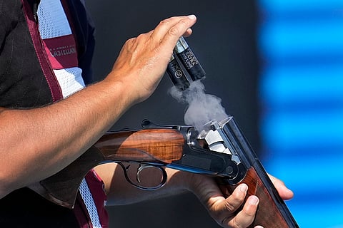 Qatar's Saeed Abusharib ejects empty cartridges during Trap Men qualification round